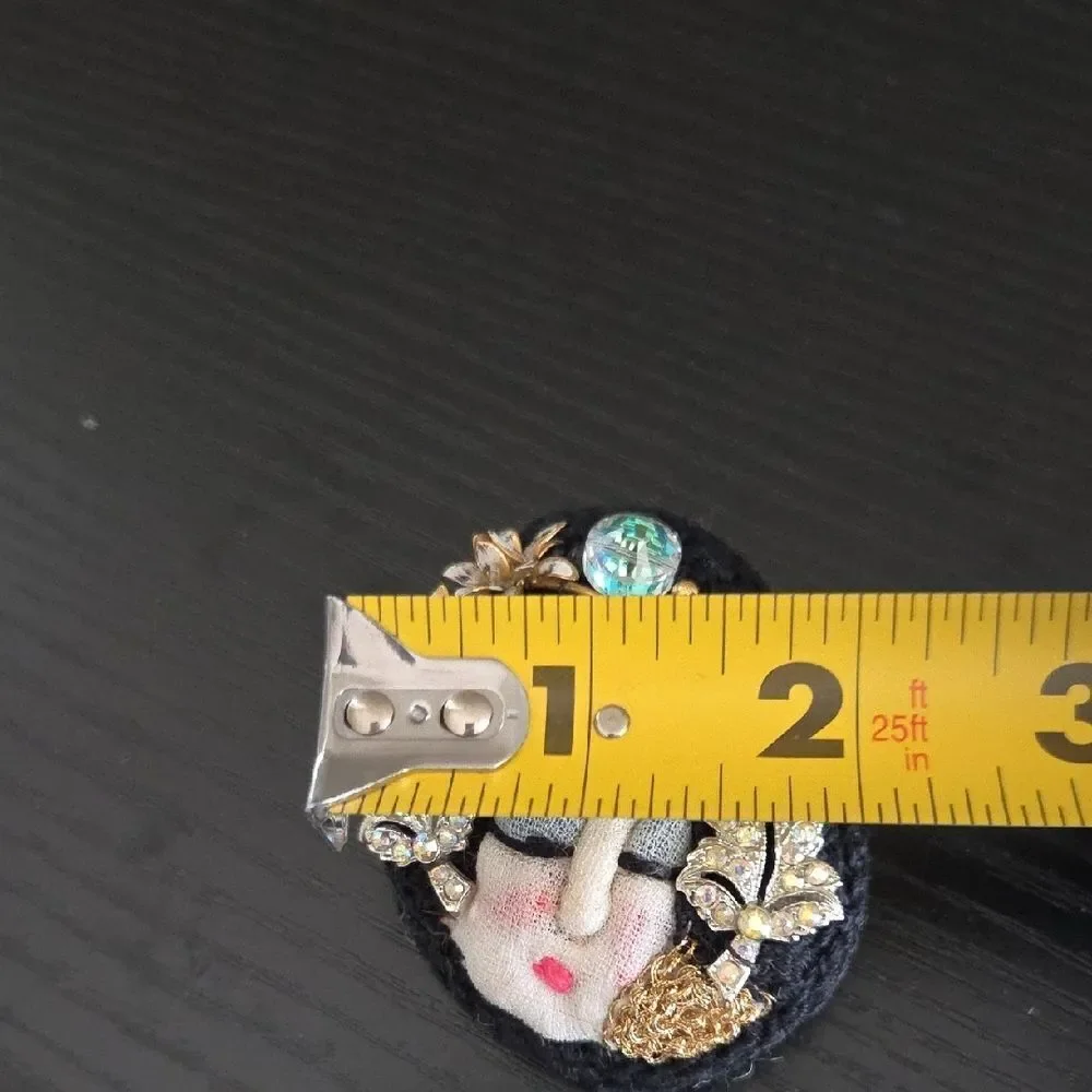 Artistic Face Brooch with Gold and Black Accents